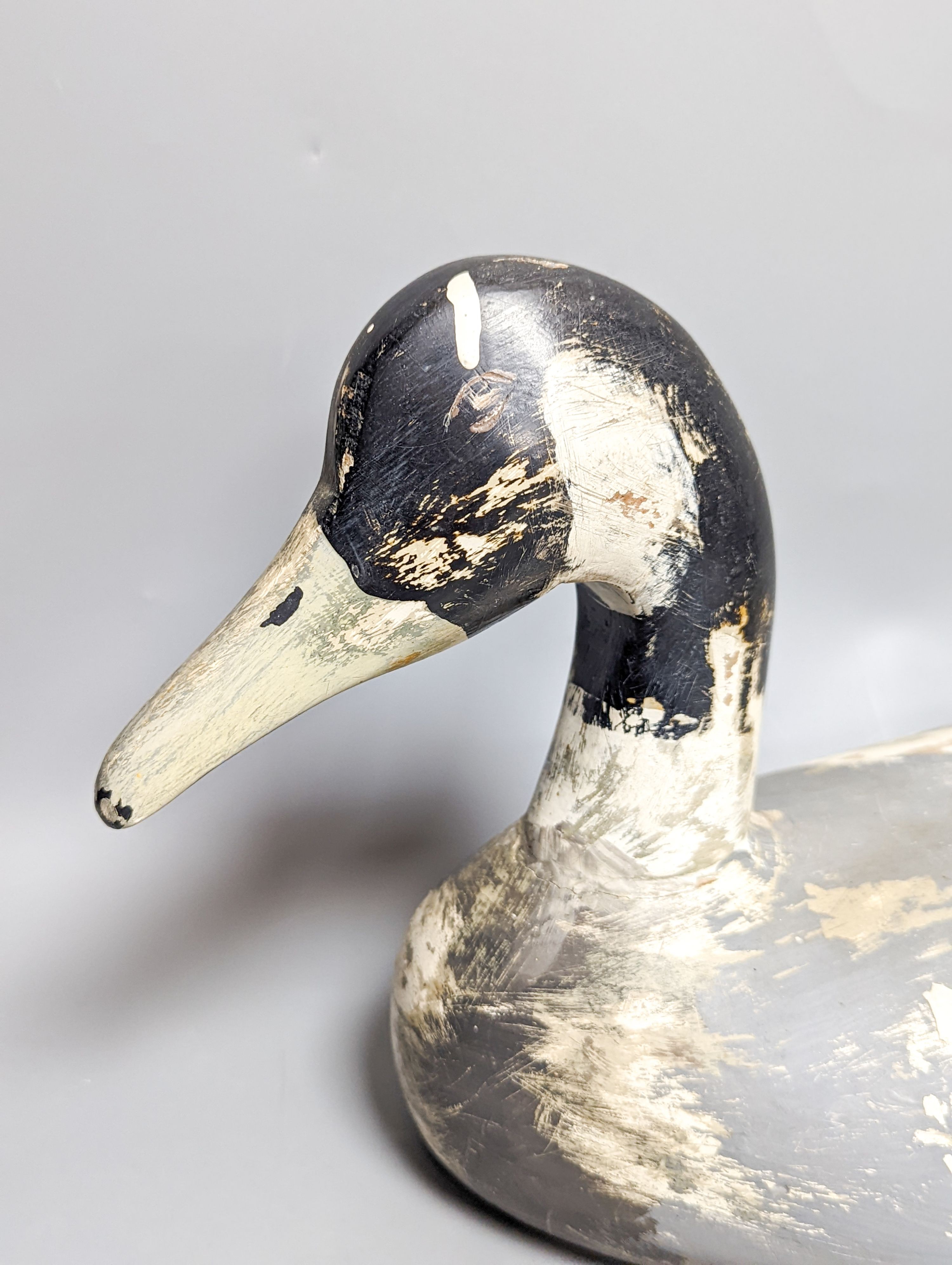 A modern painted decoy duck and a 20th century Chinese ceramic model duck (2) 42cm